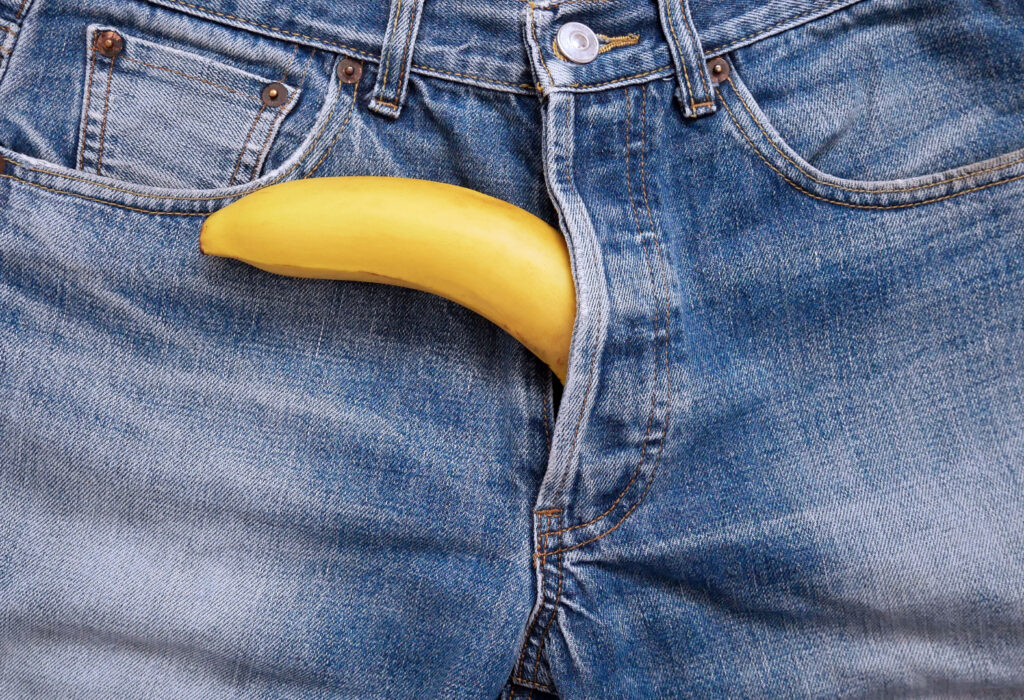 Banana out of jeans like mens penis.